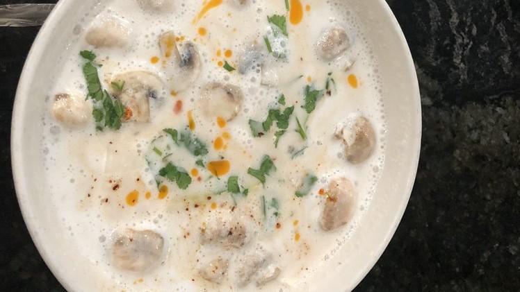 Tom Kha Gai (Gf) · Creamy coconut milk soup with chicken, yellow, and green onions, galangal, mushrooms, lemongrass, cilantro, and kaffir leaves, spiced with thai chili and lime juice. Spicy. Gluten free.