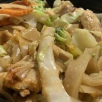 Pad See Ew** · Stir-fried flat rice noodle with choice of meat, egg, carrot, broccoli, and cabbage in speci...