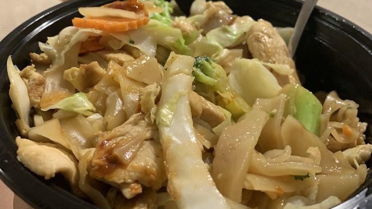 Pad See Ew** · Stir-fried flat rice noodle with choice of meat, egg, carrot, broccoli, and cabbage in special brown sauce.