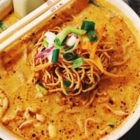 Khao Soi · Popular northern thai dish made with egg noodle and choice of meat in yellow curry-like soup...