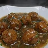 Karvepaku Veg Manchurian · Fusion appetizer made of mixed steamed vegetable dumplings deep fried and cooked with curry ...