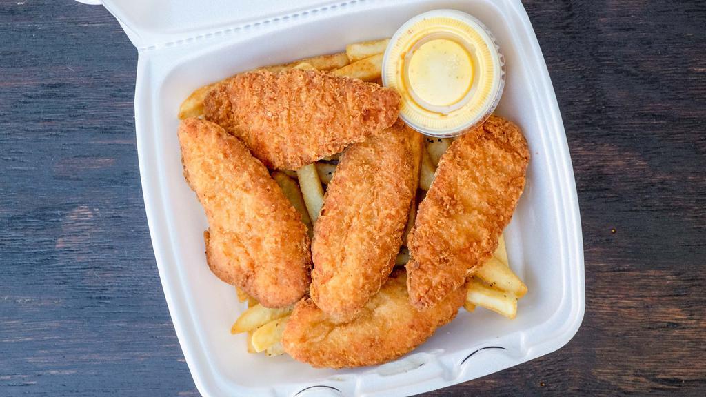 Flounder · With fries and can of soda.