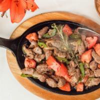 Blue Nile Special Tibs · Lamb cubes sautéed with onions, jalapeño peppers, tomatoes and special sauce.