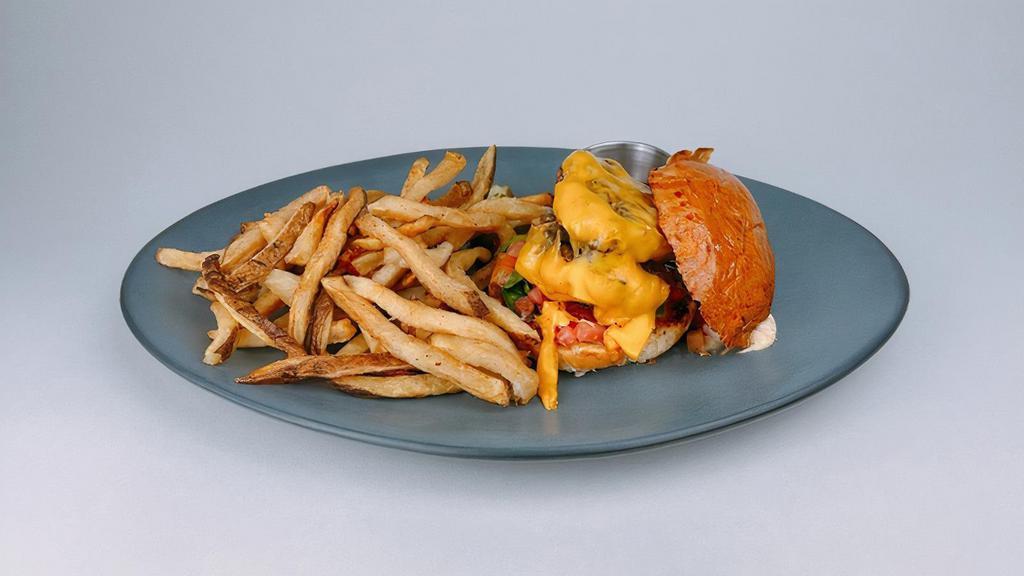All American Burger · American cheese, shredded lettuce, tomato, thousand island dressing, served with hand-cut fries