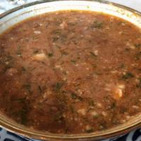 Borsch · A rich russian style beets and cabbage soup with chunks of beef, served with sour cream on t...