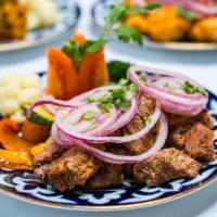 Lamb Shashlyk (Shish Kabob) · Marinated pieces of lamb tenderloin, grilled until tender, topped with red onions and served...