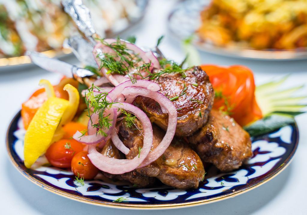 Kazan Kabob (Lamb Chops) · Stir fried seasoned lamb chops, served with steamed vegetables and white rice.