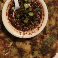 해물 파전 / Hae Mool Pa Jun · Korean pancake with Seafood.
