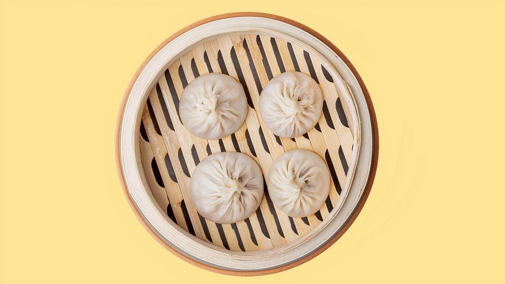 Steam Pork Soup Dumplings · Chinese soup dumplings- sometimes also referred to as Shanghai Soup Dumplings, xiaolongbao, tang bao, or “soupy buns”, are a steamed dumpling consisting of a paper-thin wrapper enveloping a seasoned pork filling and hot, flavorful soup. There are four pieces per order.