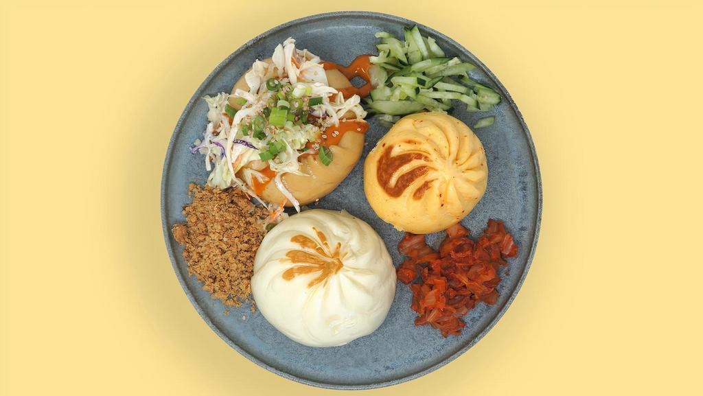 Texas Trio · Juicy Pork, Teriyaki Chicken, and Spicy Brisket Bao. Add any sauce and greens/garnish on top of these pan-seared buns. Buns contain wheat/gluten and dairy.