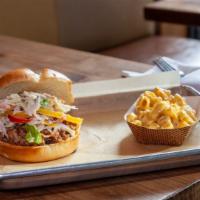 Chopped Pork Sandwich · **DONNA's FAVE** 1/4 lb Chopped Pork, topped with Creamy Coleslaw on a Potato Kaiser Roll