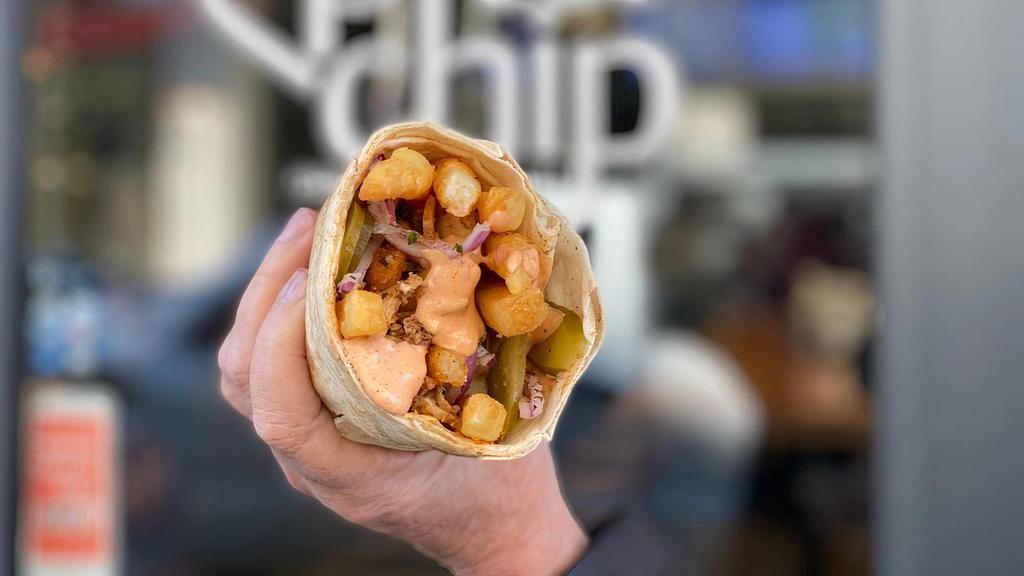 Malik Al-Batata · Pita, Chicken Shawarma, Fries, Pickles, Onions, Special Sauce. Extra dipping sauce included. **Proceeds from the sale of every sandwich are donated to Nationalities Service Center to help Afghan refugees living in the United States.**