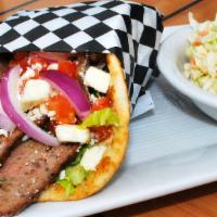 Gyro · Our house blend of lamb and beef gyro meat layered with traditional tzatziki sauce, tomatoes...
