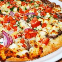 Gyro Pizza · Our traditional pizza crust layered with our house blend of lamb and beef gyro meat, tzatzik...