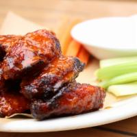 Classic Firecracker Chicken Wings · Chicken wings tossed in our spicy garlic ginger Firecracker sauce. Served with carrots, cele...