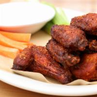 Dry Rub Wings · Chicken wings tossed in our house-made, spicy dry rub. Served with carrots, celery and blue ...