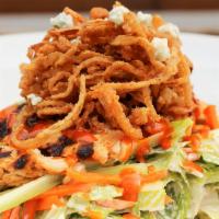 Firecracker Chicken Salad · Grilled dark meat chicken marinated in a sauce of honey, garlic, and ginger atop crisp romai...