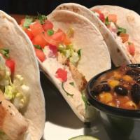 Mahi-Mahi Tacos · Three tacos with your choice of grilled or blackened Mahi-mahi, wrapped in a choice of corn ...