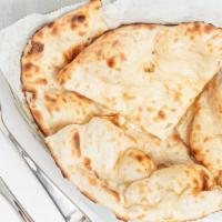 Tandoori Naan · Leavened fine flour bread baked in the tandoor.