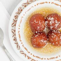 Gulab Jamun · Homemade deep fried cottage cheese balls dipped in a honey and rosewater syrup and topped wi...
