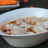 Pork Wontons In Chili Oil · Eight (8) pork wontons served in hot garlic chili oil, black vinegar, and topped with scalli...