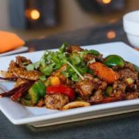 Cumin Dish · Cumin-crusted and stir-fried with bell peppers, dried peppers, and onions.  Served with whit...