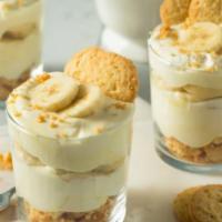 Banana Pudding · Creamy vanilla pudding with fresh banana slices, lots of whipped cream and cookies