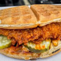 Hot Chicken Sandwich (Waffle) · Spicy Buttermilk Fried Chicken Sandwich with pickles and Thunder Sauce on a Fresh Baked Waffle