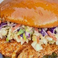 Nashville Hot Grilled Chicken Sandwich (Brioche) · spicy grilled chicken sandwich with housemade coleslaw, pickles, and thunder sauce on a hot ...
