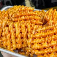 Thunder Fries · Medium Seasoned Waffle Fries topped w/ Spicy Mayo and Ancho Chile Honey Butter