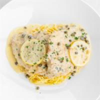 Chicken Piccata · Two 6oz. chicken breasts, pan seared, and served with lemon-caper sauce served on a bed of a...