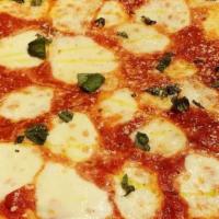 Margherita Pizza · Fresh mozzarella, organic plum tomato sauce, basil & EVOO