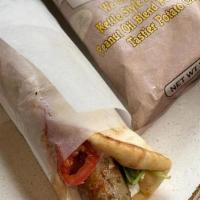 Lamb Kebab Gyro · Lamb Kebabs stuffed with Imported Feta, Tzatziki, Tomato, Red Onion, Mixed Lettuce, and Fres...