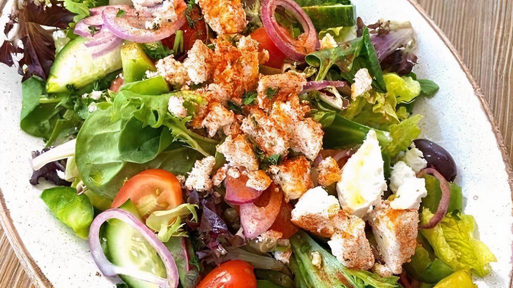 Greek Salad · Greens, Tomato, Feta, Cucumber, Green Pepper, Onion, Caper, Olives, Pepperoncini, Red Wine Vinaigrette