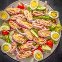 Chef'S Salad · Chef salad (or chef's salad) is an of hard-boiled eggs; ham turkey tomatoes; cucumbers; and ...