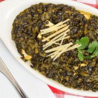 Palak Paneer · Homemade cheese cubes and spinach cooked with herbs and spices.
