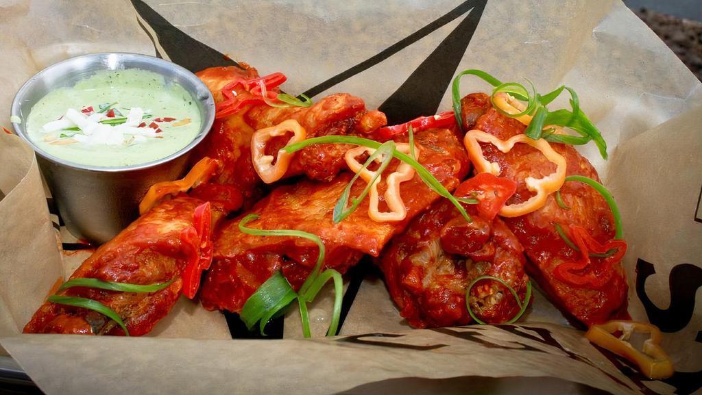 Wings · Six jumbo fried wings, tossed in your choice of sauce. Served with choice of dipping sauce.