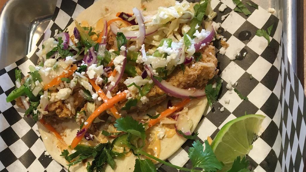 Fish Tacos · Fried or grilled with chipotle ranch, jalapeño slaw, cotija cheese, cilantro and fresh lime.