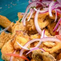 Jalea · Fried seafood platter served with yuca cassava & criolla.