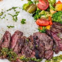 Grilled Skirt Steak With Chimichurri Sauce · Serve with steam basmati rice and extra virgin olive oil, roasted seasonal mix vegetable.