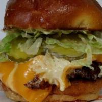 Vegas Original · 1/4lb Smash Patty, Vegas Sauce, Lettuce, American Cheese, Pickles, Onions, Toasted Sour Duck...