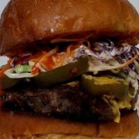 Atomic Burger · 1/4lb Patty, Buffalo Sauce, Jalapenos , + Cheese &  Ranch Slaw