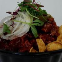 Frito Pie · House-made Chili, Cheddar Cheese, Shaved Onion + Pickled Jalapeno.  . Add Fried Egg  $1
