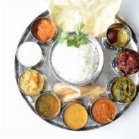 South Indian Thali · Steamed Rice, Sambar, Rasam, Kootu, Poriyal, Kaara Kozhambu, Chapati, Kurma, Yoghurt, Appala...