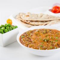 Matar Paneer · Cottage cheese and green peas cooked in a flavorful onion & tomato sauce