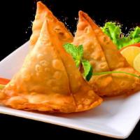 Vegetable Samosa · Deep fried snack stuffed with seasoned potatoes, peas and traditional spices – served with 2...