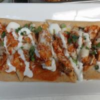Buffalo Chicken Flatbread · Flatbread with our house-made buffalo pizza sauce. Topped with diced chicken, green onions, ...