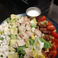 Cobb Salad · Fresh chopped romaine lettuce with chicken, tomatoes, bacon, hard boiled egg, blue cheese cr...