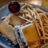 Brisket Grilled Cheese · Smoked brisket mixed with borsin cheese, served between Italian seasoned bread, with gruyere...