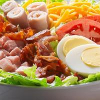 Chef Salad · A generous blend of deli ham, turkey, bacon, Cheddar and mozzarella cheeses, egg, tomato, on...